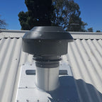 RK200 universal 200mm metal roof flume installed with an external rangehood roof motor on a corrugated tin roof.